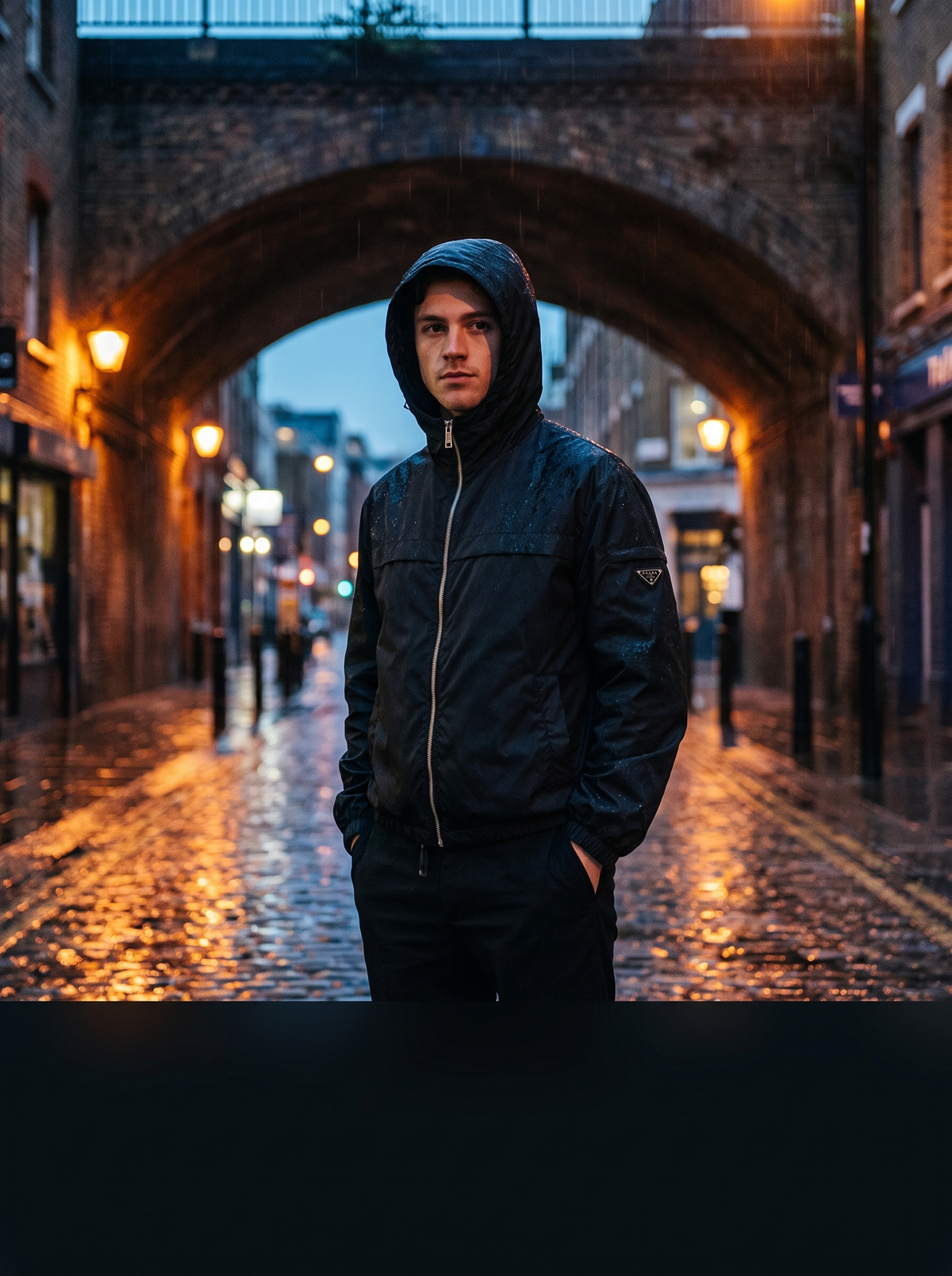 Model wearing a Prada Re-Nylon windbreaker in the London rain